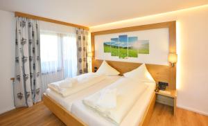 Letto o letti in una camera di Hotel Residenz Hochland
