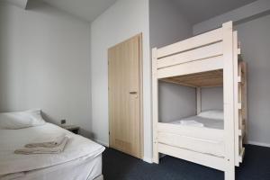 Łóżko lub łóżka w pokoju w obiekcie Polin House