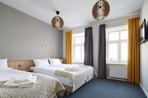 Łóżko lub łóżka w pokoju w obiekcie Polin House