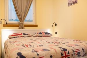 Кровать или кровати в номере Pianeta Oro Apartments