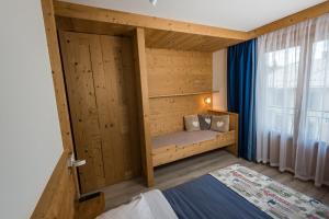 Postel nebo postele na pokoji v ubytování Hôtel Flor'Alpes