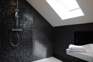 a bathroom with a shower and a sink at Seascapes in Inch