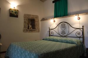 Postel nebo postele na pokoji v ubytování Il Castello sul Lago