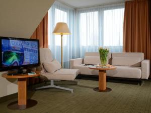 En tv och/eller ett underhållningssystem på Hotel Residenz Oberhausen