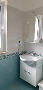 a bathroom with a sink, toilet and tub at Stella Marina Agropoli in Agropoli