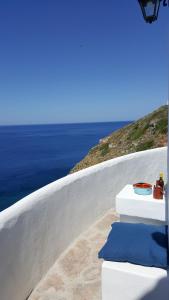 a view of the ocean from a white wall at Aegean Eye Apartments in Kástron