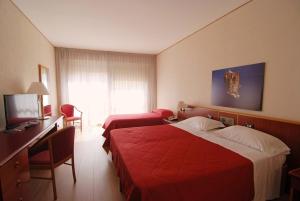 Postel nebo postele na pokoji v ubytování Hotel Torre Normanna