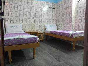 Ein Bett oder Betten in einem Zimmer der Unterkunft Perfect Guest House