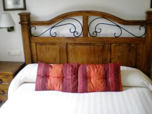 Posteľ alebo postele v izbe v ubytovaní Apartamentos San Martin