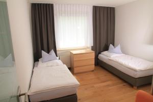 מיטה או מיטות בחדר ב-Comfort Lodging Stueckenfeld