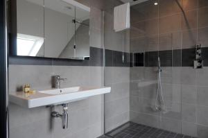 a bathroom with a sink and a shower at Seascapes in Inch