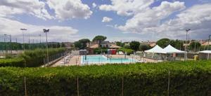 a large swimming pool in a park with at Riviera del Conero in Porto Recanati