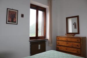 A bed or beds in a room at Il Castello sul Lago