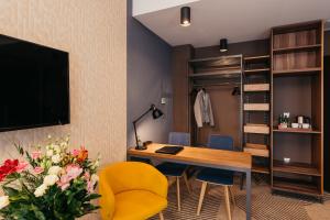 Televízia a/alebo spoločenská miestnosť v ubytovaní Avena Boutique Hotel by Artery Hotels