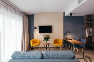 Televízia a/alebo spoločenská miestnosť v ubytovaní Avena Boutique Hotel by Artery Hotels