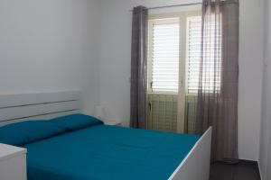 Cama ou camas em um quarto em The Green Seaside