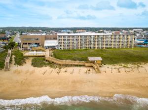 an aerial view of a hotel on the beach at Ramada Plaza by Wyndham Nags Head Oceanfront in Kill Devil Hills