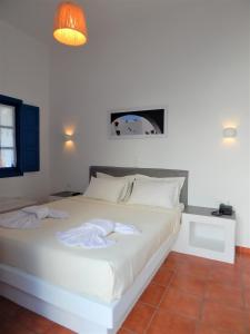 Postel nebo postele na pokoji v ubytování Aegeo Hotel