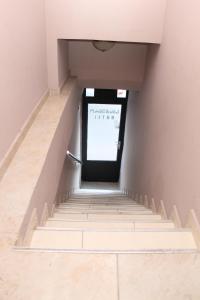 a set of stairs leading up to a door at Hotel Peria in Batumi