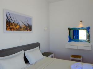 Postel nebo postele na pokoji v ubytování Aegeo Hotel