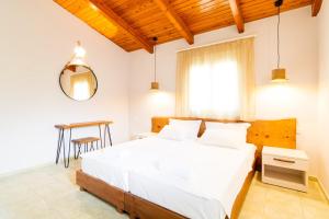 Ένα ή περισσότερα κρεβάτια σε δωμάτιο στο Sunrise Apartments