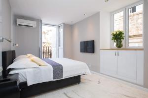 Postel nebo postele na pokoji v ubytování Soleil Luxury Rooms Old town