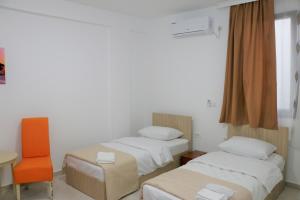 Postel nebo postele na pokoji v ubytování Hotel Old Konak