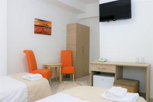 Postel nebo postele na pokoji v ubytování Hotel Old Konak