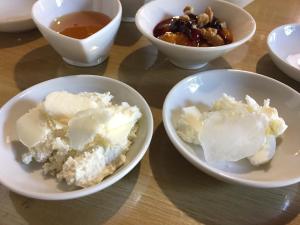 a group of bowls of food on a table at Konak Lapeistra Hotel in Gure