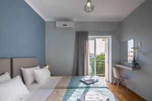 Кровать или кровати в номере N&A Chania Apartment