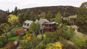 an aerial view of a house on a hill at Kauri House Apartment in Wanaka