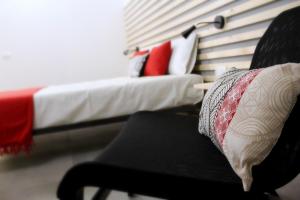 A bed or beds in a room at Le Mangiatoie del Cavaliere