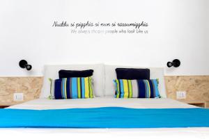 A bed or beds in a room at Le Mangiatoie del Cavaliere