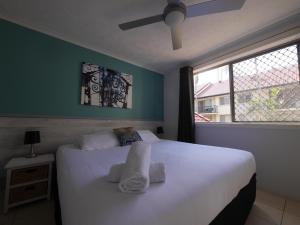 
A bed or beds in a room at K Resort Surfers Paradise Apartments
