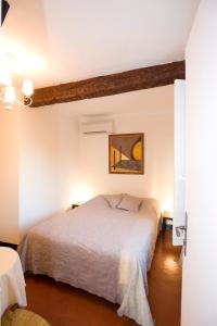 Postel nebo postele na pokoji v ubytování Le Vieux Château