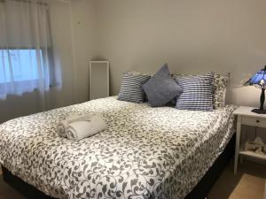 A bed or beds in a room at Ambrosia Holiday Home