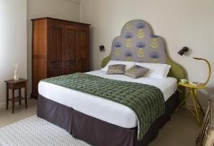 Un pat sau paturi într-o cameră la Brusco rooms