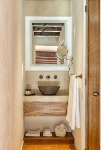 a bathroom with a sink and a mirror at Morazul Hotel Boutique in Querétaro
