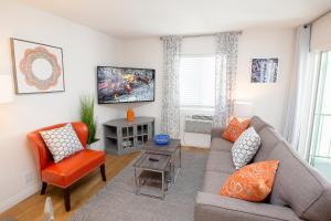a living room with a couch and two chairs at Big Balcony - Parking Spot - King Bed - Fast WiFi in Long Beach