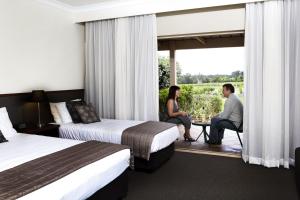 Postel nebo postele na pokoji v ubytování Harrigan's Hunter Valley + 29 fotografií