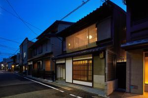 an empty street in an asian city at night at Marukyo Gakurin-an in Kyoto