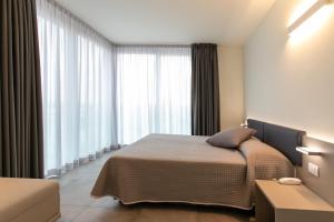 Postel nebo postele na pokoji v ubytování Residence Panama