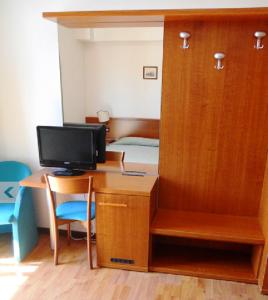TV a/nebo společenská místnost v ubytování Hotel Traghetto