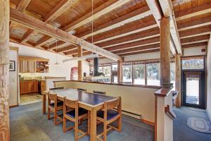 a kitchen with a table and chairs in a room at 2035 Homestead Condo in Keystone