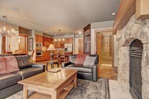 a living room with a couch and a fireplace at 3044 Lone Eagle Condo in Keystone