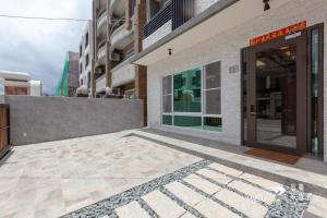 a building with a glass door in a city at SunShine B&B in Taitung City