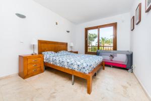 En eller flere senge i et værelse på Apartment Resort La Recoleta