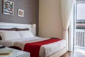 A bed or beds in a room at NovaNova
