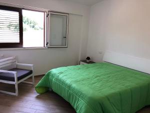 Postel nebo postele na pokoji v ubytování Scopello Guidaloca Villas