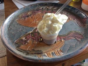 a glass plate with a drink on a table at La Valle Dei Corbezzoli in Sassari